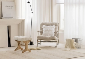 French style beige luxury sofa cushion on a modern armchair in a minimalist living room