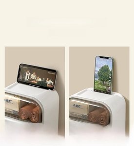 Detail view of the toilet paper holder top slot supporting a smartphone horizontally