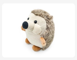Detailed view of the soft beige hedgehog plush toy with realistic brown faux fur texture