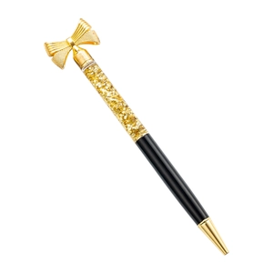 Elegant gold bow ballpoint pen featuring glitter-filled chamber and black metallic body