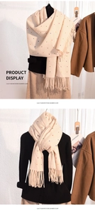 Detail of soft imitation cashmere scarf with colorful polka dots and fringe tassels