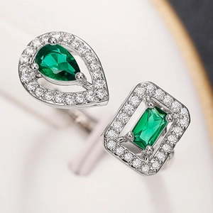 Exquisite silver open ring featuring green emerald zircon stones in drop and square shapes