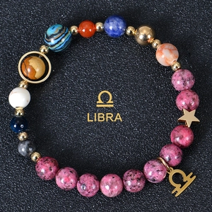 Natural stone Libra zodiac bracelet with colorful beads and gold Libra charm on black