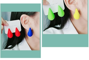 Detailed close-up of matte waterdrop earrings in red, blue, green, and yellow colors