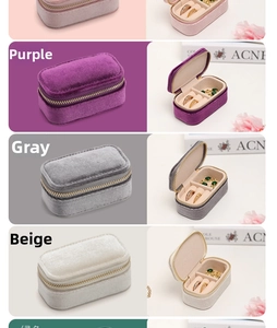 Detail of velvet travel jewelry box interiors with ring slots and zipper closure