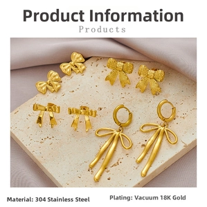 Detail of assorted 18K gold plated 304 stainless steel bow earrings on stone and silk