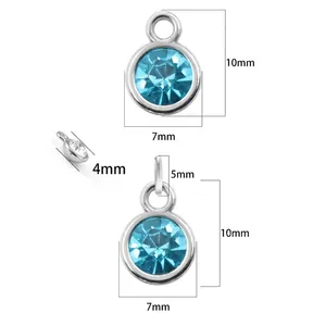 Light blue glass birthstone pendant in silver-tone setting with dimensions shown