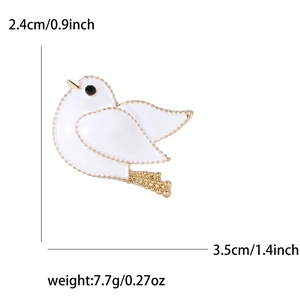 Fashionable white enamel dove brooch with gold plating and olive branch detail
