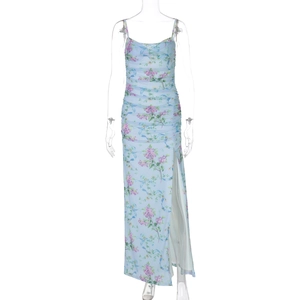 Detail of light blue floral dress with ruching, spaghetti straps and a high side slit