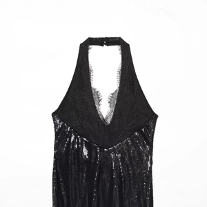 Chic black halter neck dress with intricate lace trim and sparkling sequin embellishment