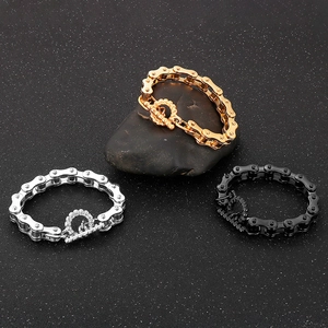Detailed view of three-color motorcycle chain bracelets in gold silver and black with OT clasp