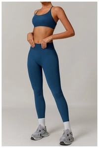Vertical view of high-waist seamless yoga set with dark blue sports bra and leggings