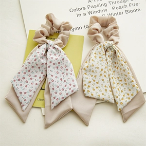 Beige floral satin scrunchies with long ribbon streamers for hair styling accessories