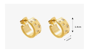 Macro detail of 18K gold plated C-shape earrings with zircon star pattern and 1.4cm size