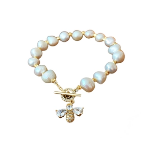 Baroque freshwater pearl bracelet with golden bee pendant and zircon toggle clasp