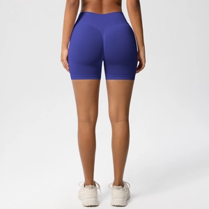 Rear view of seamless high-waist yoga shorts with peach lift contour and V-shape stitching