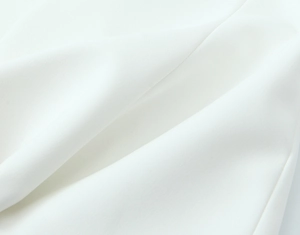 Close-up of white high-density blend fabric texture with smooth drape and fine weave