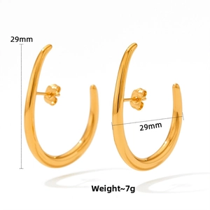Detail showing 29mm diameter of golden polished half round C-shape crescent earrings