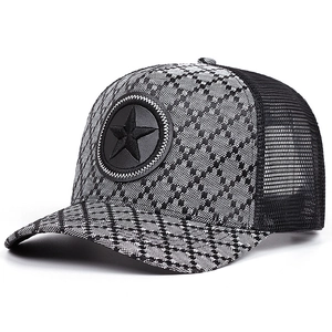 Detail of black jacquard mesh trucker hat with 3D embossed star patch on front