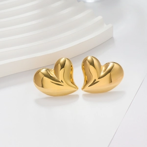 Close-up of heart-shaped 18K gold-plated stud earrings on a clean white background