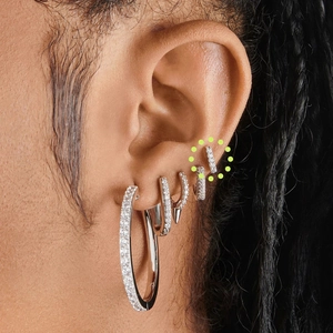 Close-up of S925 sterling silver hoop earrings set with sparkling zircon on a model