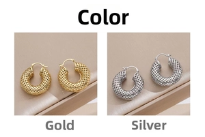 Detailed close-up of hollow mesh metal hoop earrings in gold and silver finishes