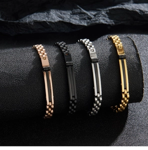 Detail view of four stainless steel chain bracelets in rose gold, silver, black, and gold
