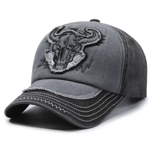 Vintage washed baseball cap featuring a bull skull embroidery and a distressed finish