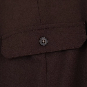Detailed view of dark brown shirt dress fabric with matching resin buttons and stitching