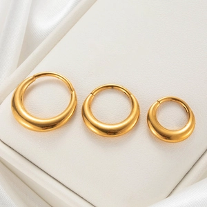 Three-piece set of golden G23 titanium hoop earrings in small, medium, and large sizes