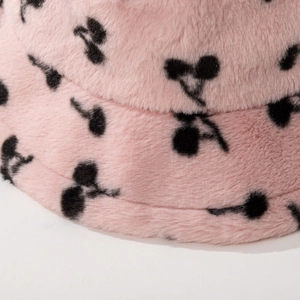Pink plush bucket hat with black cherry pattern in soft faux fur for women