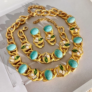 Vintage gold chain jewelry set with turquoise gemstones, pearls and green crystals