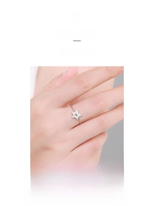 Macro shot of S925 sterling silver chain ring with pavé-set crystal hollow star charm