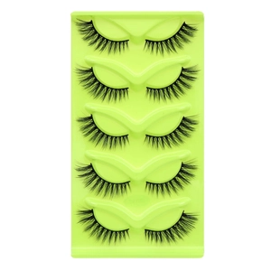 Five pairs of fox-style cat-eye false eyelashes in a bright neon green tray for a dense natural look