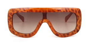 Close-up of vintage oversized aviator sunglasses with leopard print frame and brown lenses