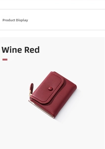 Macro detail of burgundy litchi texture leather wallet with gold metal zipper closure