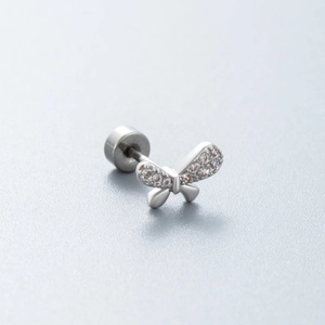 Silver butterfly earring with sparkling cubic zirconia on a gradient grey background