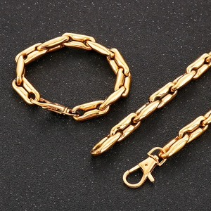 Detail of gold coffee bean link chain bracelet and necklace set with lobster clasp