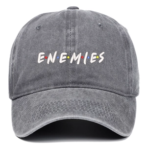 Macro shot of ENEMIES 3D embroidery and washed denim texture on gray baseball cap