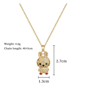 Detailed view of golden rabbit pendant with full diamond pavé and size measurements