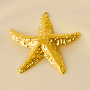 Close-up of golden starfish pendant with textured surface for DIY jewelry making