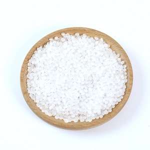 Realistic white translucent PVC grain models displayed on a round wooden tray