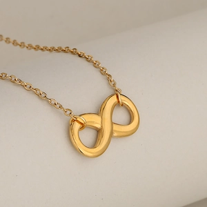 Elegant gold infinity symbol necklace featuring a polished finish on a minimalist chain