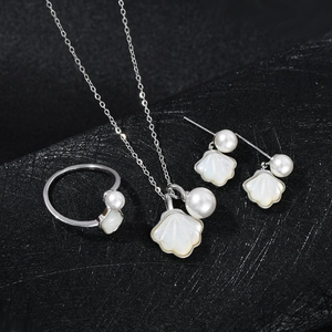 Elegant silver shell jewelry set featuring necklace, stud earrings and open ring for women