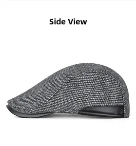 Side view of winter wool blend newsboy cap with faux leather trim and plaid texture
