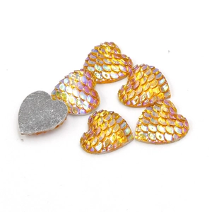 Golden 14mm heart-shaped resin cabochons with fish scale texture and iridescent rainbow finish