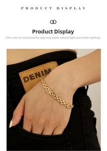 Macro detail of 18K gold-plated watch-band style chain bracelet with zircon stones