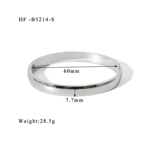 Detailed view of 7.7mm wide polished silver titanium steel bangle with 60mm diameter