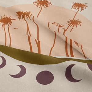 Detailed close-up of woven fabric texture with bohemian palm and crescent print