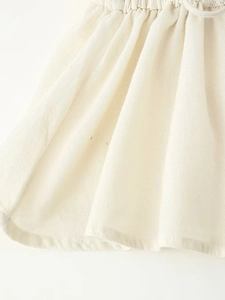 Close-up of cotton linen fabric texture with ethnic embroidery and lace stitching